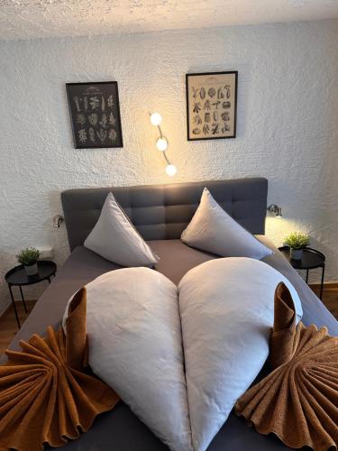 a bed with two pillows on top of it at Weidach Zentrum 1 in Leutasch