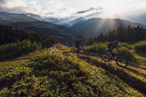 two people riding bikes on a mountain trail at Müelera in Blatten bei Naters