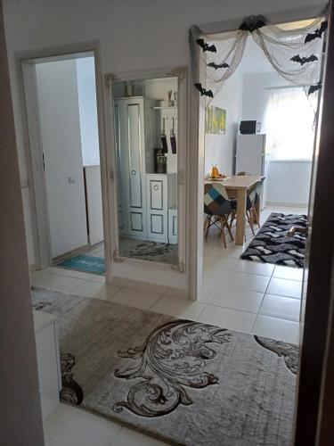 a view of a living room with a mirror at Apartament Ramonte in Zărneşti