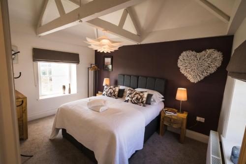 A bed or beds in a room at Maison Cottage
