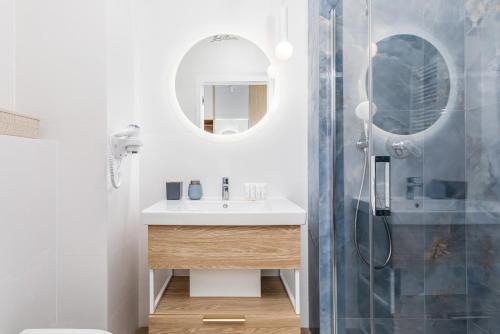 a bathroom with a sink and a shower at Rent like home - Bel Mare F324 in Międzyzdroje