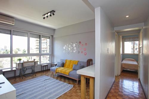 a living room with a couch and a table at Stylish 3 BR Family Apt in Palermo in Buenos Aires