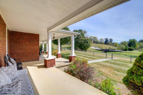 an outdoor patio with a brick wall and a pavilion at 3 Mi to South Holston Lake Home with Mtn Views in Bristol