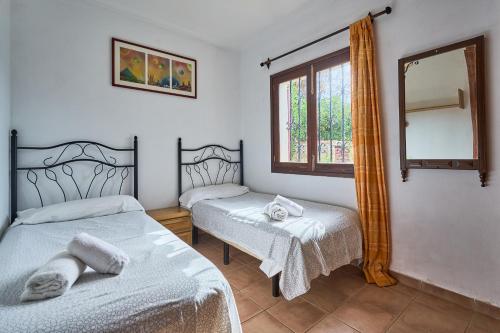 Postel nebo postele na pokoji v ubytování Villa Goleta 10