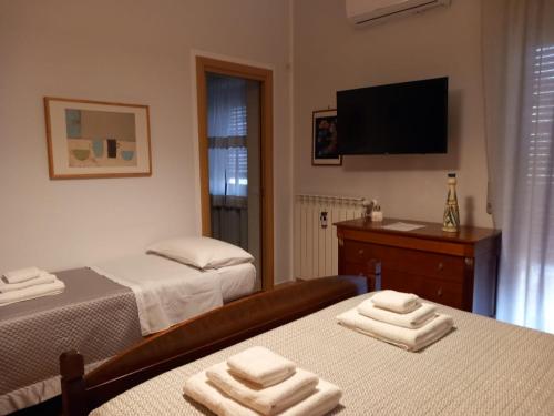 Una cama o camas en una habitación de Le Stanze di Nonna Lina