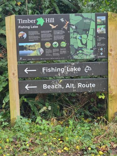 a sign for the beginning of the trail at 9 Timber Hill in Broad Haven