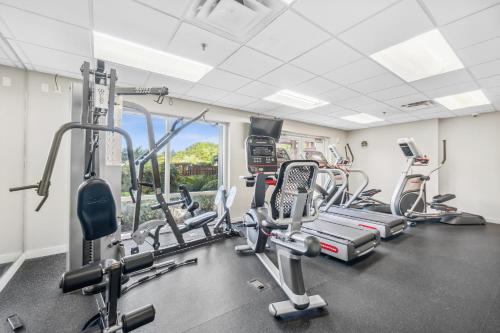 a gym with cardio machines and a window at Luau at Sandestin Tower I & II in Destin