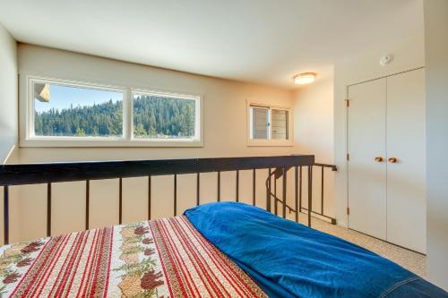 a bedroom with a bed and a window at Cozy Condo with Balcony - Near Big Sky Resort! in Big Sky