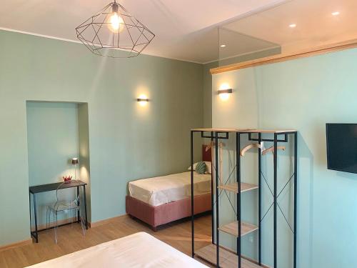 a room with a bed and a glass shelf at Villa Josette in Sant'Egidio del Monte Albino
