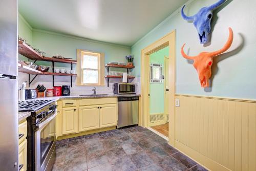a kitchen with two deer heads on the wall at Canary Cottage-brighten your stay-central NW OKC in Oklahoma City