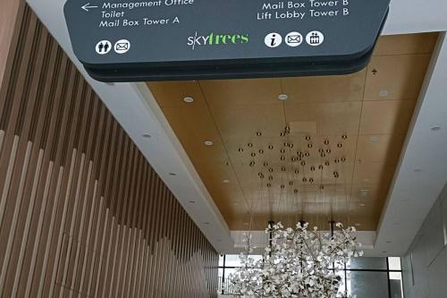 a sign hanging from the ceiling of a building at High-Floor Sky Trees City Views & Facilities A23 in Johor Bahru
