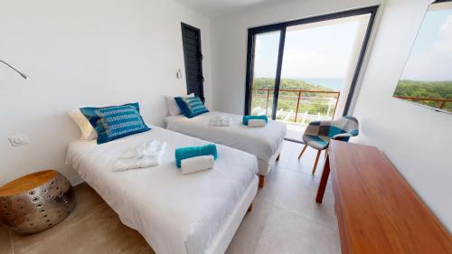 THE VIEW - Magnifique Villa face à la Merにあるベッド