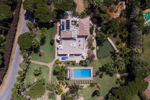 an aerial view of a house with a swimming pool at Villa Natura by Algarve Holidays in Vilamoura
