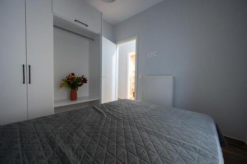 Ένα ή περισσότερα κρεβάτια σε δωμάτιο στο Central Studio SKG