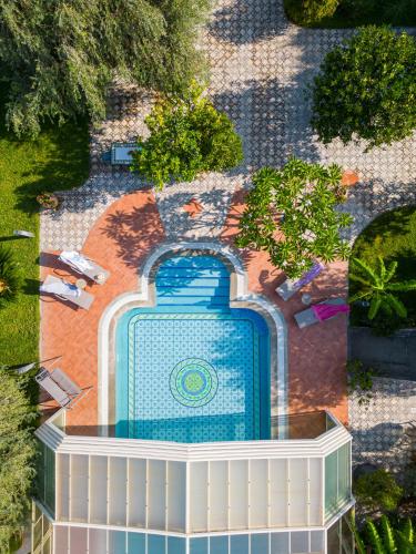 an overhead view of a swimming pool in a garden at Villa Rita Taormina in Taormina