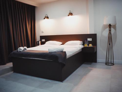 a bedroom with a large bed with white sheets at Kadıköy Duck hotel in Istanbul