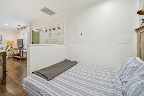 a bedroom with a bed and a desk in a room at Downtown Wilmington Studio in Historic District! in Wilmington