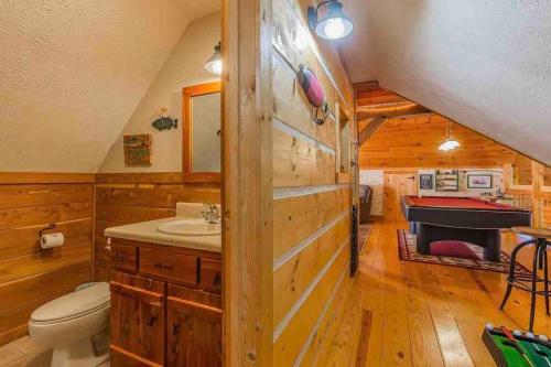 a bathroom with a sink and a toilet and a piano at Heaven’s View Lodge, Pool, Pet Friendly in Dunlap