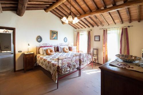 a bedroom with a bed in a room at Villa Iris with Swimming Pool in Capannori