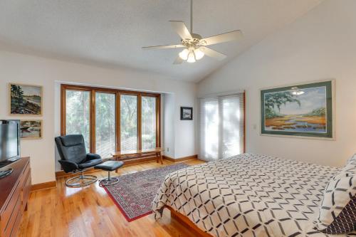 a bedroom with a bed and a ceiling fan at Spacious Kiawah Island Home with Deck, Walk to Beach in Johns Island
