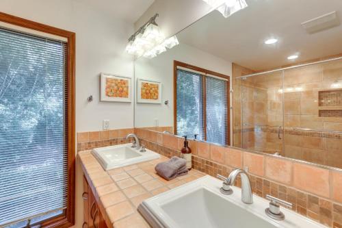 a bathroom with two sinks and a large mirror at Spacious Kiawah Island Home with Deck, Walk to Beach in Johns Island