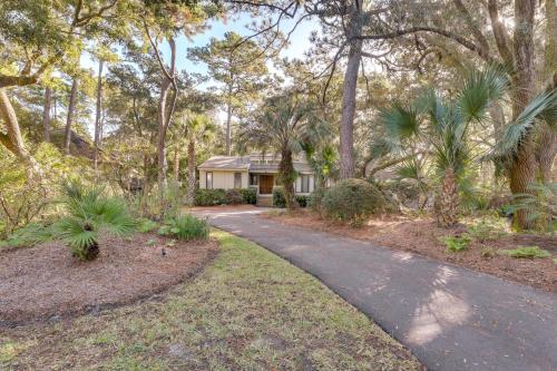 a home in the woods with a driveway at Spacious Kiawah Island Home with Deck, Walk to Beach in Johns Island