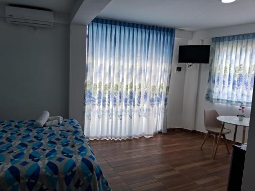 Ένα ή περισσότερα κρεβάτια σε δωμάτιο στο Las Fragatas Casa Hotel