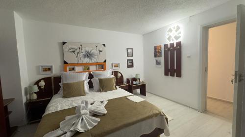Ένα ή περισσότερα κρεβάτια σε δωμάτιο στο Casa Mina