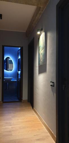 a hallway with a door and a painting on a wall at Love Journey Tbilisi in Tbilisi City