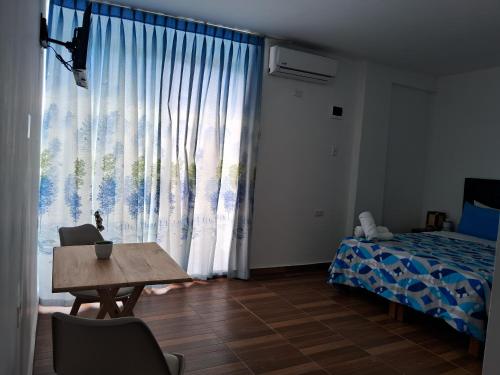 Ένα ή περισσότερα κρεβάτια σε δωμάτιο στο Las Fragatas Casa Hotel