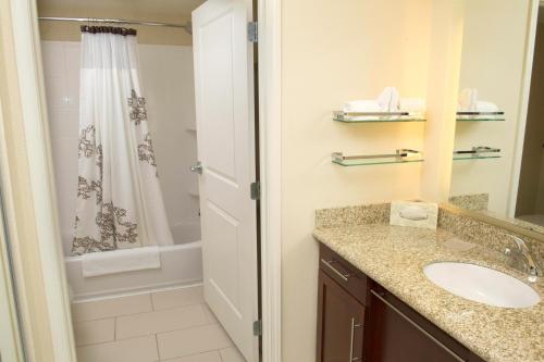 a bathroom with a sink and a shower at Residence Inn by Marriott Columbia Northwest/Harbison in Columbia