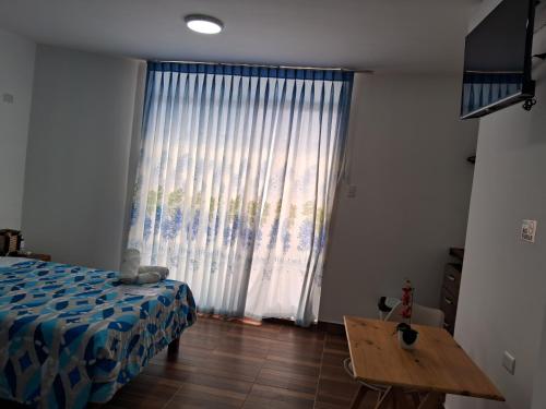 Ένα ή περισσότερα κρεβάτια σε δωμάτιο στο Las Fragatas Casa Hotel