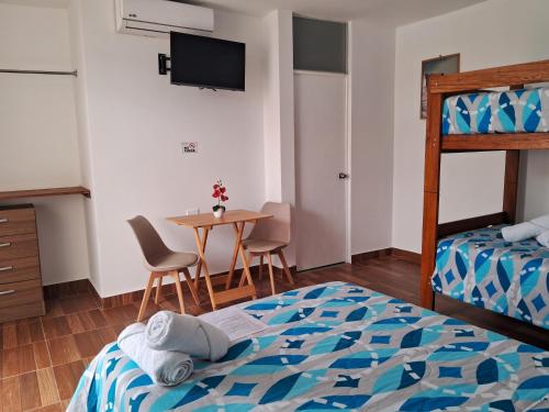 Ένα ή περισσότερα κρεβάτια σε δωμάτιο στο Las Fragatas Casa Hotel