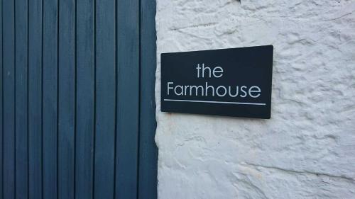 a sign on the side of a building at Rachel's Farm luxury escapes with Hots Tubs in Buchlyvie