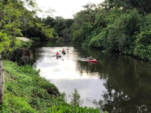 a group of people are in a river at Key Lime Tiny Home New&Cozy in Sarasota