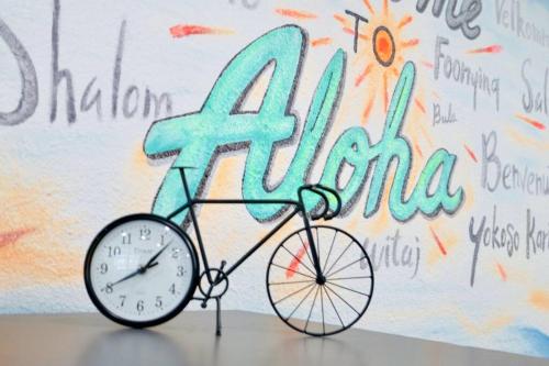 a clock on a bike in front of a wall at Key Lime Tiny Home New&Cozy in Sarasota