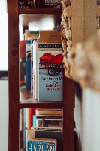 a book shelf with a harlan book on it at Riviera Punta Cana Eco Travelers in Punta Cana