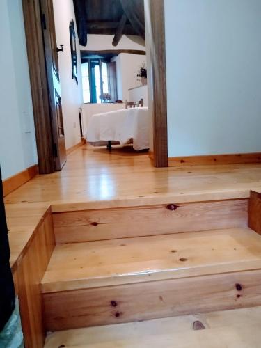 a stairway in a room with a bed at Casa Pacios by M de Santiago in Tríacastela