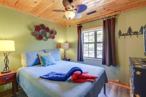 a bedroom with a bed with two towels on it at Above and Beyond Pigeon Forge Cabin with Prime Views! in Pigeon Forge