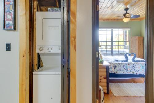 a laundry room with a washer and dryer in a house at Above and Beyond Pigeon Forge Cabin with Prime Views! in Pigeon Forge