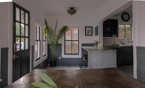 a kitchen with a counter and a plant in it at Clinton House - Master in Lafayette