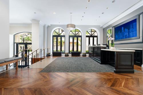 a large room with white walls and wooden floors and windows at Holiday Inn Express Chicago - Magnificent Mile by IHG in Chicago