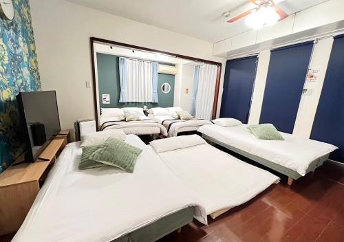 Giường trong phòng chung tại Regalia Hills Shibuya Dogenzaka - Vacation STAY 15550