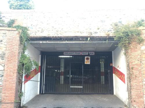 an entrance to a building with a gate at Carmen Aljibe de la Miel in Granada