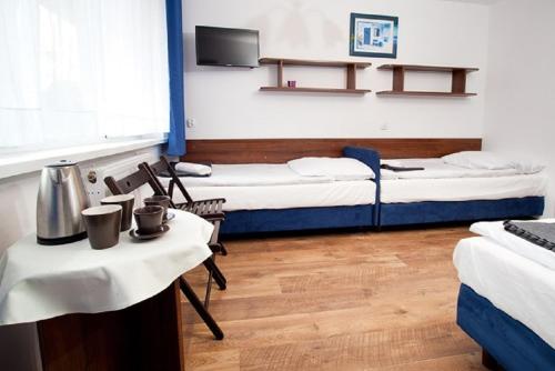 מיטה או מיטות בחדר ב-Ośrodek Wypoczynkowy Diuna Jastrzębia Góra