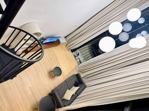 an overhead view of a living room with a couch at (New) Fettes Villa for 20Pax @CentralPenang/Gurney in George Town