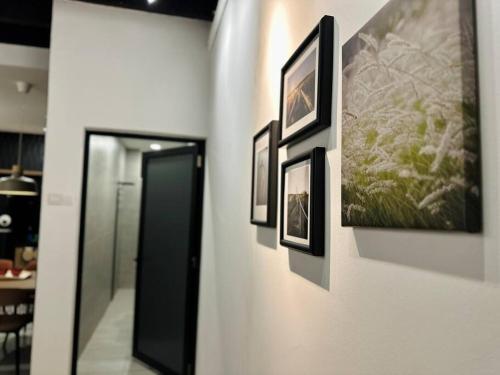 a group of pictures hanging on a wall at (New) Fettes Villa for 20Pax @CentralPenang/Gurney in George Town