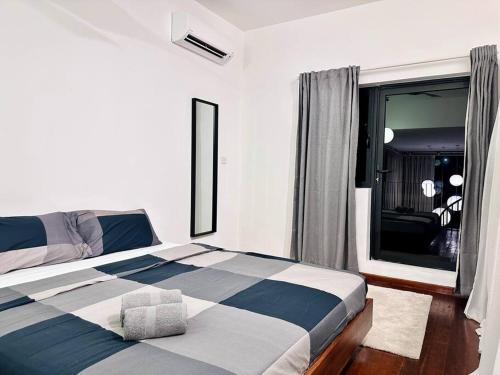 a bedroom with a large bed with a window at (New) Fettes Villa for 20Pax @CentralPenang/Gurney in George Town