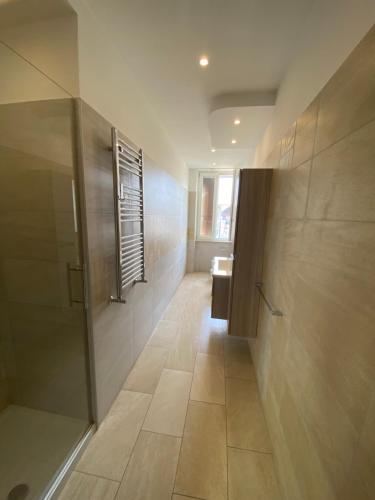 a bathroom with a walk in shower and a sink at La Dimora di Antonella in Naples