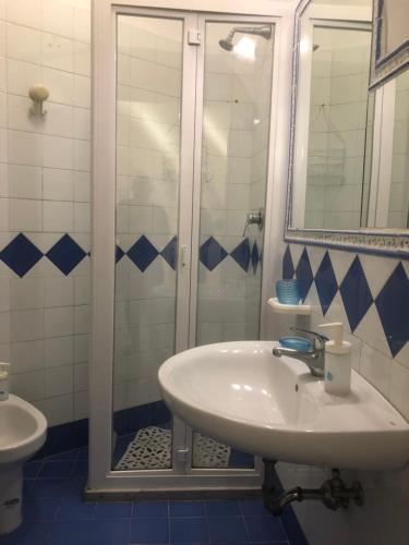 a bathroom with a sink and a shower at La casa a mare in Cetara